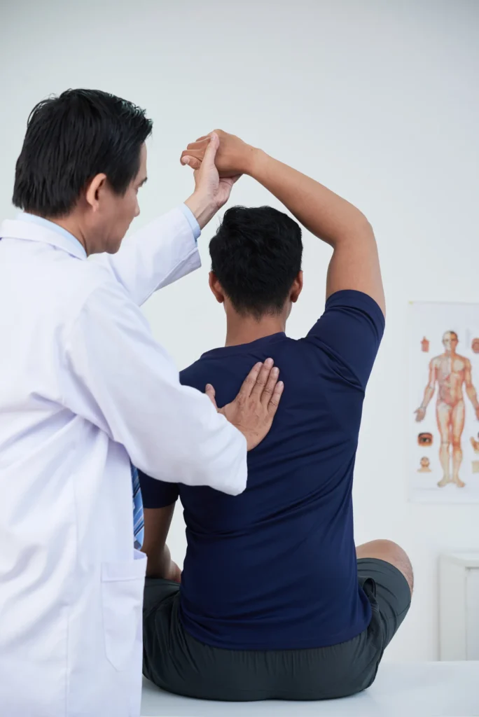 Osteopath treating patient during a therapy session